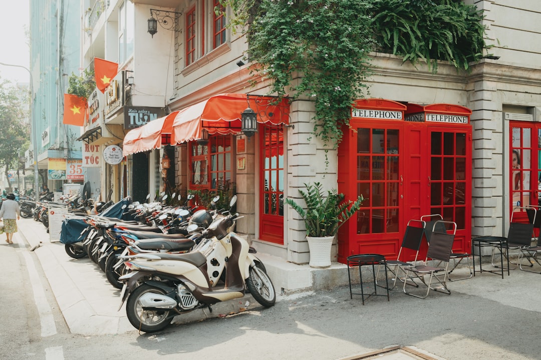 French colonial architecture in Ho Chi Minh City with motorbikes parked outside