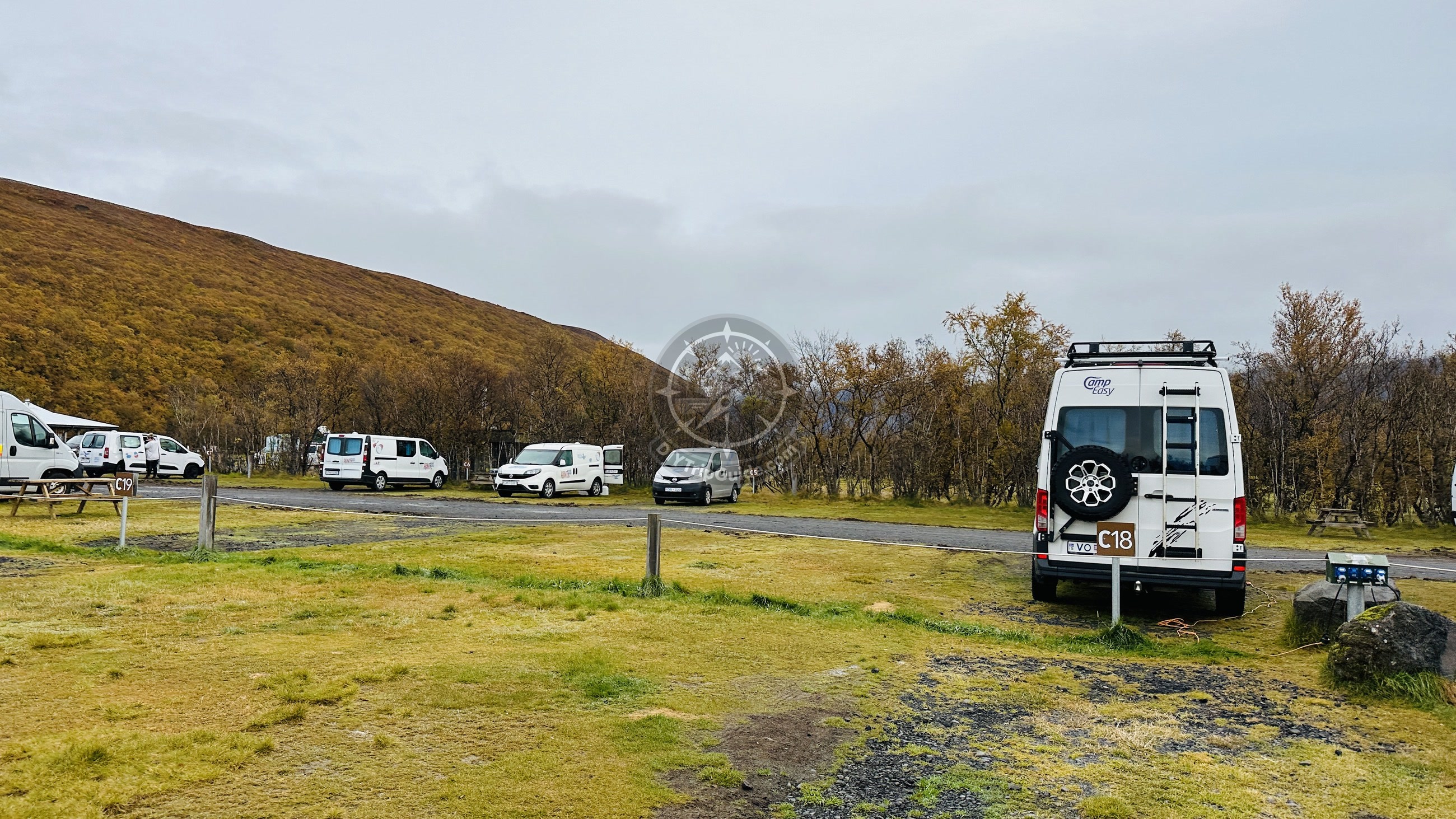 Skaftafell campsite on October 1, with camper vans and the mountain landscape beyond the site.