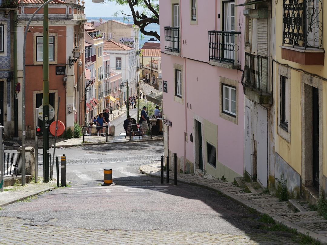 Panoramic view of Lisbon rooftops and the Tagus River on a spring day
