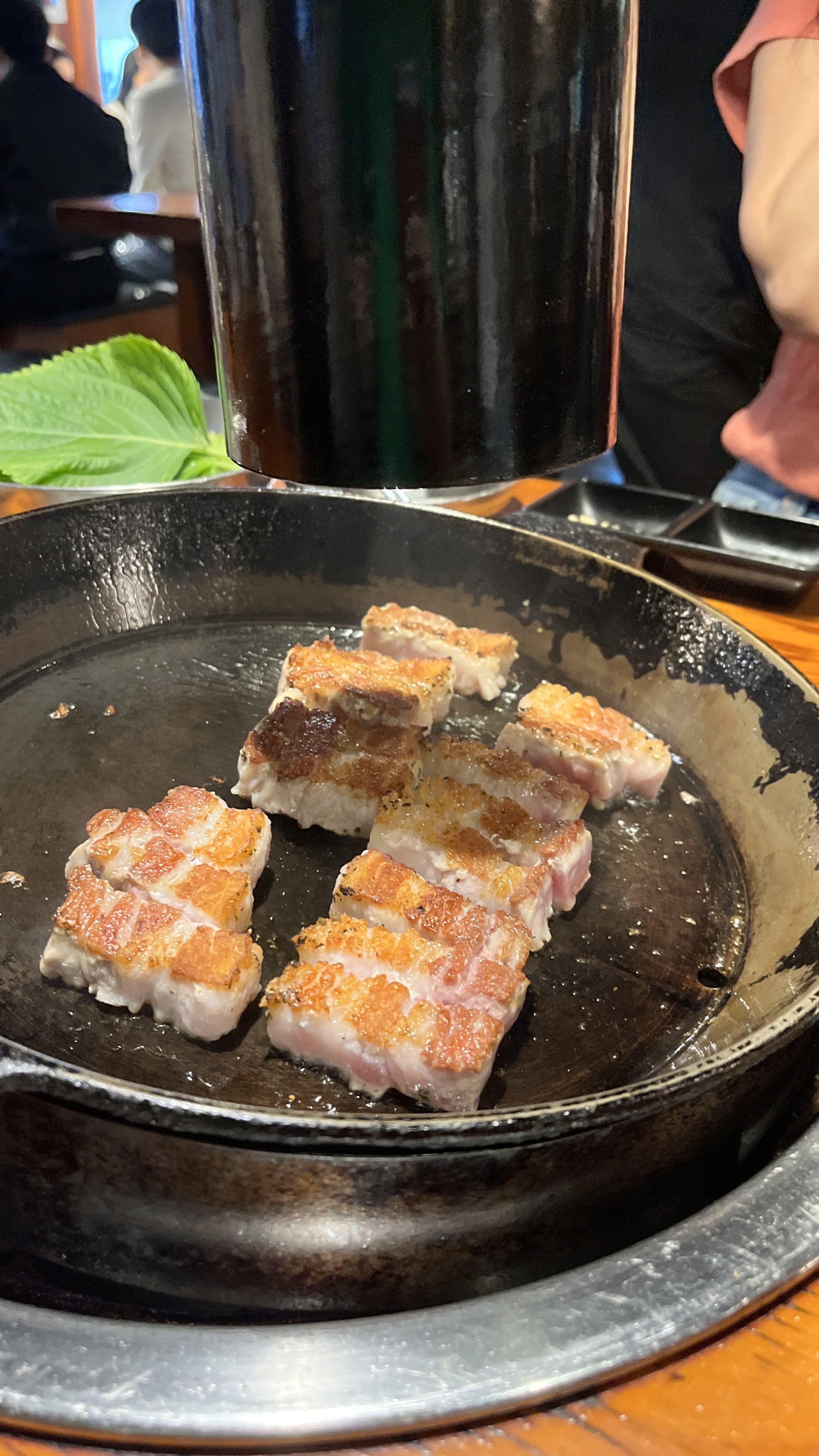Thick-cut pork belly grilling at Haengbok Chupungnyeong Kal restaurant