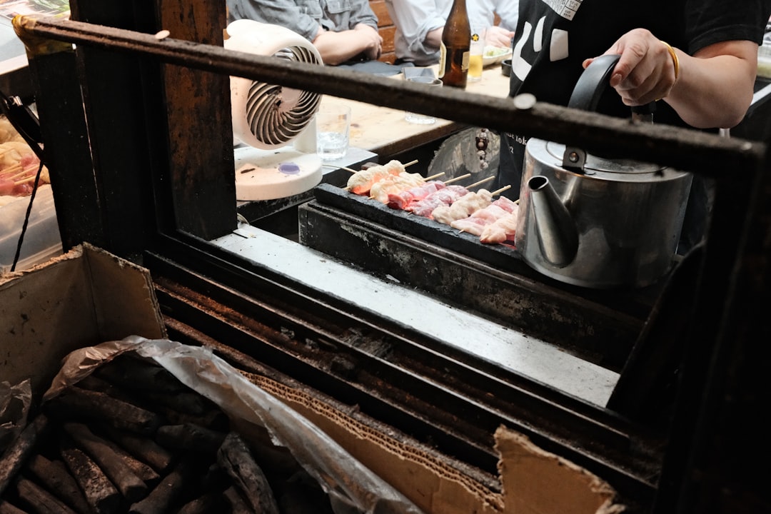 Close-up of Japanese street food being prepared at a Tokyo market stall