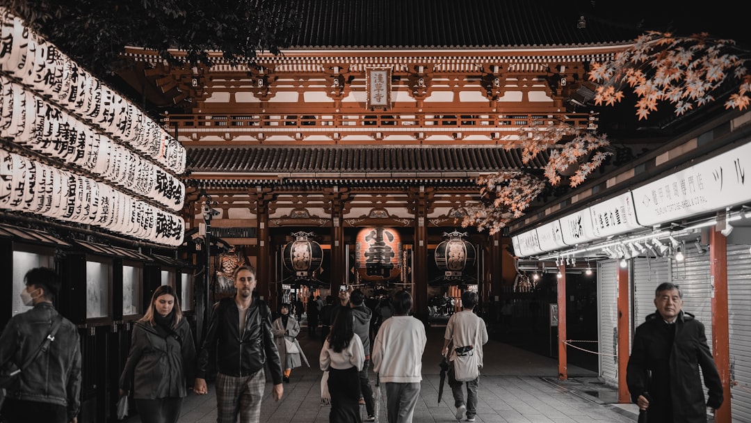 Traditional Japanese temple gate in Tokyo surrounded by trees